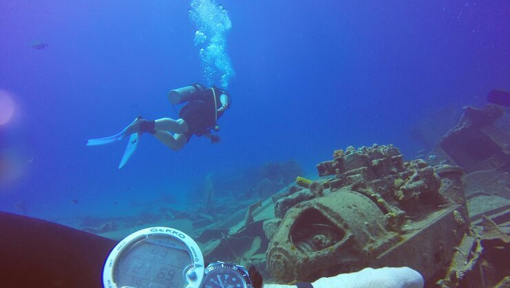 picture of diver above shipwreck